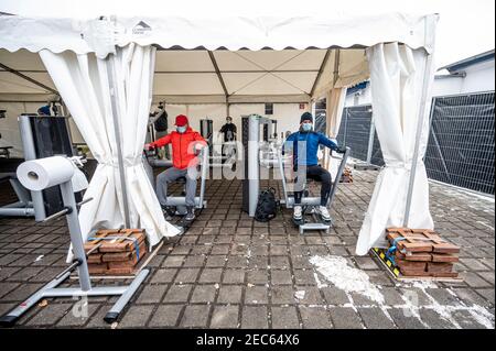 Berlin, Germany. 13th Feb, 2021. Several people work out in a tent outside a gym. A gym chain opens several outdoor gyms with a special hygiene concept even during the lockdown. Credit: Fabian Sommer/dpa/Alamy Live News Stock Photo