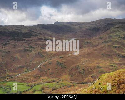 View from Helm Crag over to Easedale Tarn and Langdale Pikes, Lake District Stock Photo