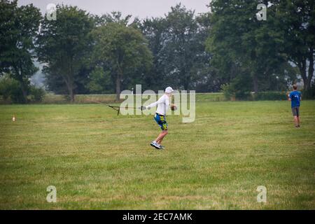 Lviv, Ukraine - July 23, 2017: Unknown aircraft modeler  launches his own radio-controlled  model  glider  in the countryside near the city of Lviv., Stock Photo