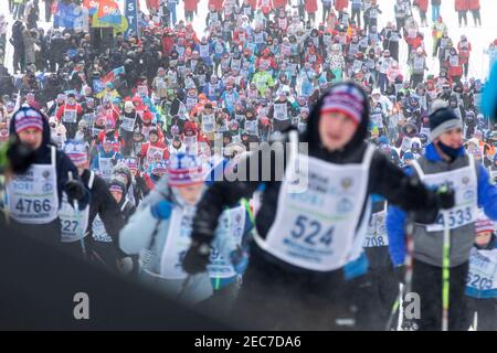 Moscow region, Russia. 13th of February, 2021 People take part in annual All-Russian 'Ski-track of Russia' mass ski race (Lyzhnya Rossii) at Planernaya Olympic Training Center, Moscow region, Russia Stock Photo