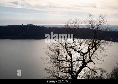 Lake Albano (Italian: Lago Albano or Lago di Castel Gandolfo) in the Castelli Romani, looking towards Castel Gandolfo, and the Mediterranean Sea beyon Stock Photo