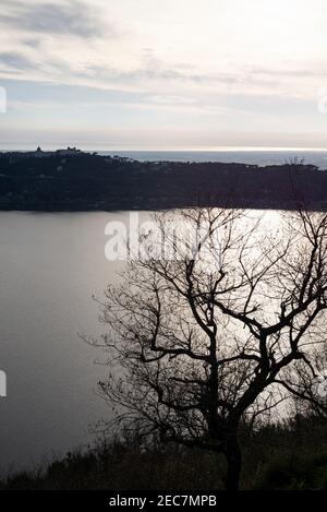Lake Albano (Italian: Lago Albano or Lago di Castel Gandolfo) in the Castelli Romani, looking towards Castel Gandolfo, and the Mediterranean Sea beyon Stock Photo