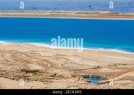 Salt on the beach of the dead sea in Israel border with Jordan. Stock Photo