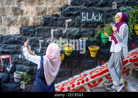 Fashion women in Umbrella street. Zajal restaurant Al Balad Steps, off Prince Muhammad Street, Al Rjoum, Amman, Jordan, Middle East. Stock Photo