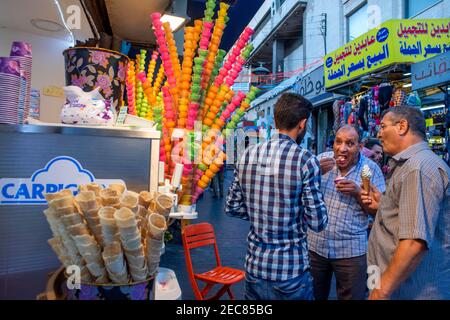 Multicoloured ice cream cones shop, a traditional street food seen for sale near the Roman Theatre, in the Old Town of Amman, Jordan. Stock Photo