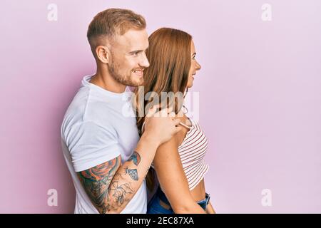 Cute Boyfriend And Girlfriend Posing In White Studio Stock Photo - Download  Image Now - iStock