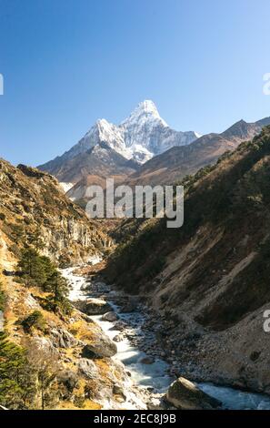mountain river in the mountains, ama dablam peak on the way to Everest Base Camp, trekking and hiking in Nepal, beautiful landscape in Sagarmatha Nati Stock Photo