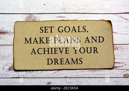 Text on brown paper with burnt edge. Success concept Stock Photo