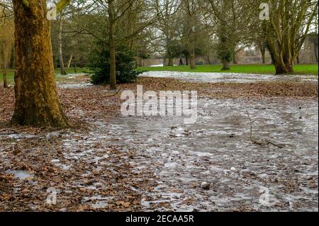 Eton, Windsor, Berkshire, UK. 13th February, 2021. Following freezing temperatures and flooding over the past the few days, parts of the playing fields at Eton College have iced over. Temperatures are set to rise again next week bringing a welcome end to the cold snap. Credit: Maureen McLean/Alamy Live News Stock Photo