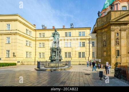 Tourists enter the Charles Bridge Museum near the statue of Charles IV in the Knights of the Cross Square near the Old Tower in Prague, Czechia Stock Photo