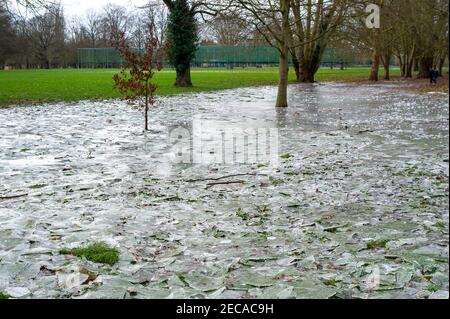 Eton, Windsor, Berkshire, UK. 13th February, 2021. Following freezing temperatures and flooding over the past the few days, parts of the playing fields at Eton College have iced over. Temperatures are set to rise again next week bringing a welcome end to the cold snap. Credit: Maureen McLean/Alamy Live News Stock Photo