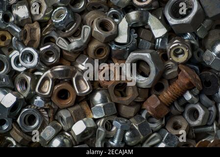 Macro view of a collection of old nuts and bolts of various types and sizes. Stock Photo