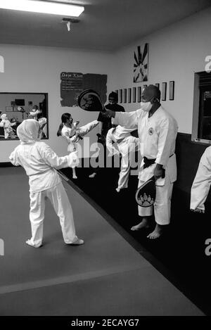 This action photo is of my son and his classmates in a Karate class. Karate is a physically and mentally challenging sport that builds agility. Stock Photo