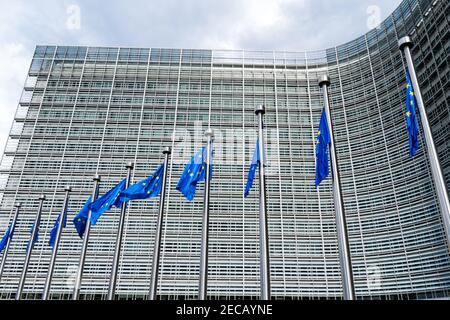 EU European flags in front of the Berlaymont building, headquarters of the European Commission, Brussels, Belgium