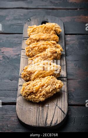 Fried Chicken Wings Parts On Old Dark Wooden Table Stock Photo - Alamy