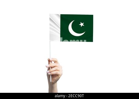 Beautiful female hand holding Pakistan flag, isolated on white background. Stock Photo