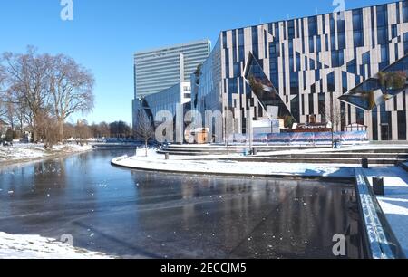 Architecture by Daniel Libeskind in Duesseldorf - the famous Kö-Bogen belonging to the Königsallee with snow in winter Stock Photo