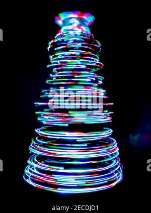 Colored light lines spinning in a cone shape Stock Photo