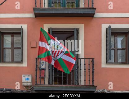 House facade with flag Athletic Bilbao in the old town of Bilbao, Spain Stock Photo