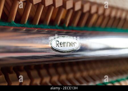 Open upright piano. Louis Renner action close up. German piano action, internal mechanism. Piano tuning, repair and maintenance. Hammers. Stock Photo