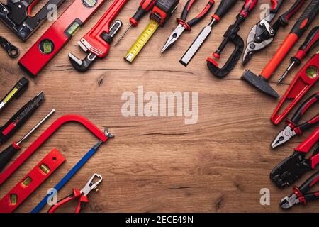 Assorted work tools on wooden background Stock Photo