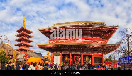 Tokyo, Japan - 2 January 2020: Senso Ji shinto temple main gate and pagoda with unrecognisable crowd of people. Stock Photo