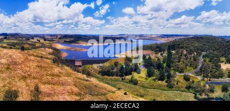 Concrete dam on Fish river in Oberon town forming Lake Overon - wide aerial panorama over river creek and town hills. Stock Photo
