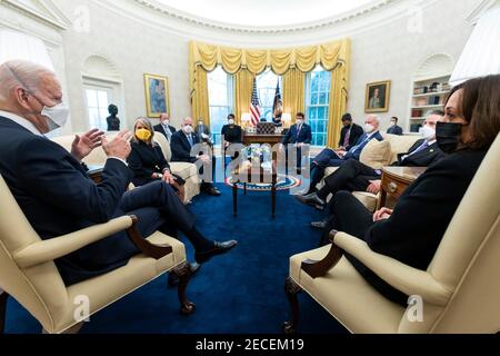 Washington, United States Of America. 12th Feb, 2021. U.S President Joe Biden, left, and Vice President Kamala Harris, right, during a meeting with governors and mayors in the Oval Office of the White House February 12, 2021 in Washington, DC Credit: Planetpix/Alamy Live News Stock Photo