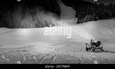 Black and White Photo of a Snow Making Machine on the Ski Slopes of Sun Peaks in the Shuswap Highlands of British Columbia, Canada Stock Photo