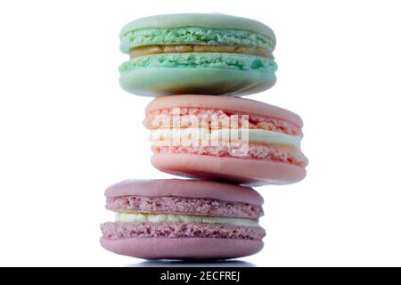 A close up stack of three macarons on an isolated white background Stock Photo