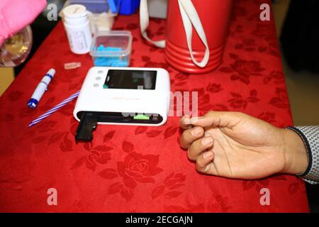Blood donor at donation, transfusion. Close up right arm of a business man receiving blood in hospital. Healthcare and charity. Pekalongan, December 1 Stock Photo