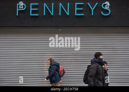 Dublin, Ireland. 13th Feb, 2021. People walk past a closed Penneys store on Henry Street. Credit: SOPA Images Limited/Alamy Live News Stock Photo