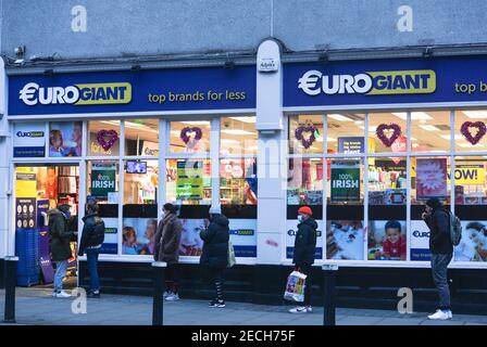 Dublin, Ireland. 13th Feb, 2021. People wait to enter Euro Giant store. Credit: SOPA Images Limited/Alamy Live News Stock Photo