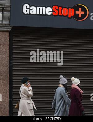 Dublin, Ireland. 13th Feb, 2021. People walk past a closed GameStop store on Henry Street. Credit: SOPA Images Limited/Alamy Live News Stock Photo