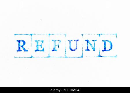 Blue color ink rubber stamp in word refund on white paper background Stock Photo