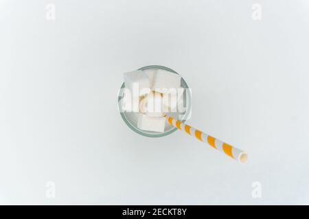 sugar in a glass with a straw cocktail sweets energy Stock Photo