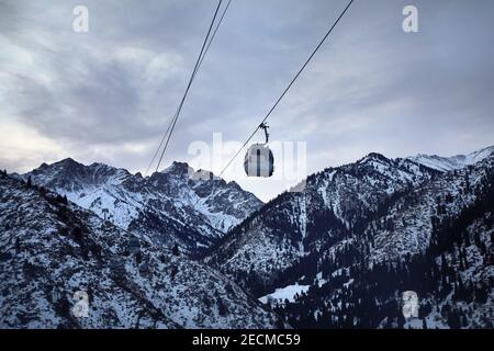 Cableway with funicular in the winter mountains at Shymbulak mountain resort in Almaty, Kazakhstan Stock Photo
