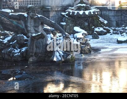 Triton fountain in Duesseldorf with snow and ice in winter Stock Photo