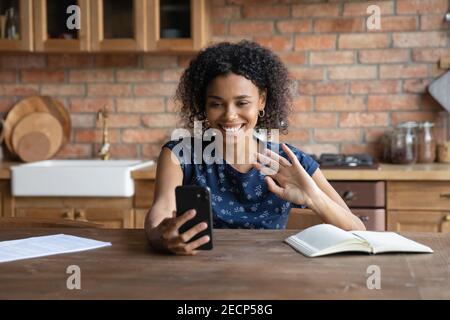 Close up smiling African American woman making video phone call Stock Photo