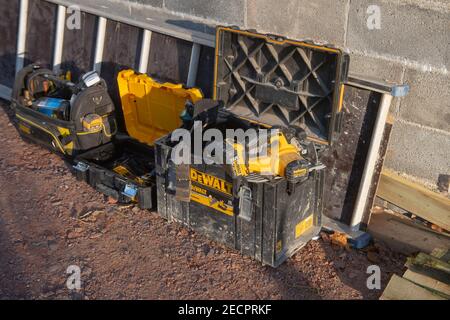 Battery Operated Rechargeable DeWalt Power Tools in a Tool Box on a Construction Site in Rural Devon, England, UK Stock Photo
