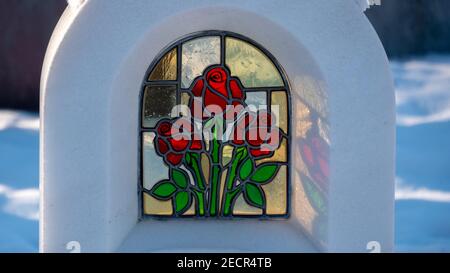 Marble tomb with red roses Stock Photo