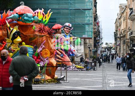 Valletta, Malta. 13th Feb, 2021. A carnival-themed installation is seen on a street in Valletta, Malta, on Feb. 13, 2021. Maltese carnival enthusiasts do not let the COVID-19 pandemic dampen their passion for carnival as they still work on their colorful floats and exhibit them in a static art installation rather than a parade, in line with pandemic restrictions. Credit: Jonathan Borg/Xinhua/Alamy Live News Stock Photo