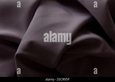 Close-up texture of purple fabric or cloth in purple color. Fabric texture of purple background. crumple purple fabric. Stock Photo