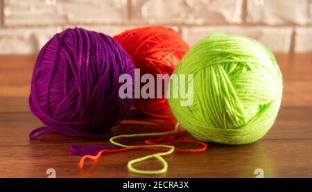 Yarn of wool for knitting on white background. Green, pink, blue, purple  tangle. Needlework, handmade. Isolated. Copy space Stock Photo - Alamy