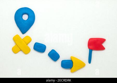 Modelling clay navigation sign on white background. Bright navigation sign isolated. Road signs clipart. Route start and destination pointer. Red flag Stock Photo