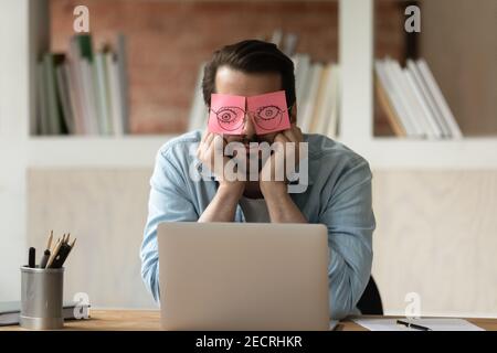 Unmotivated tired male employee sleep in office Stock Photo