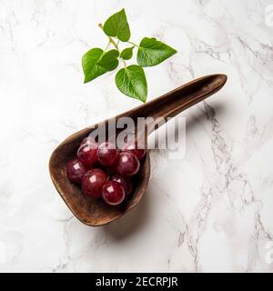 hand carved wooden snack board on the table Stock Photo