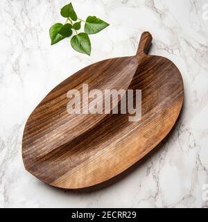 hand carved wooden snack board on the table Stock Photo