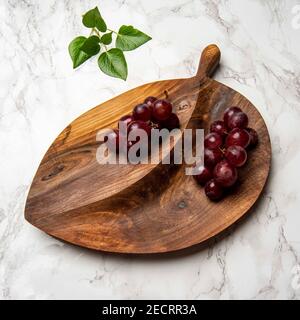 hand carved wooden snack board Stock Photo