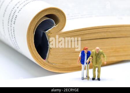 Senior couple and open book. Reading people of senior age. Elderly couple in library concept banner. Aged people leisure. Relaxing hobby for old perso Stock Photo